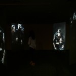 2_Minha LEE_trapped people1_Videon Installation View_Acrylic panel with rear screen projection_7.5x7.5x(h)2.7m_2014